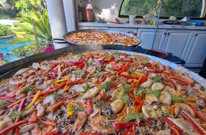 Large seafood paella pan with prawns, calamari and peppers