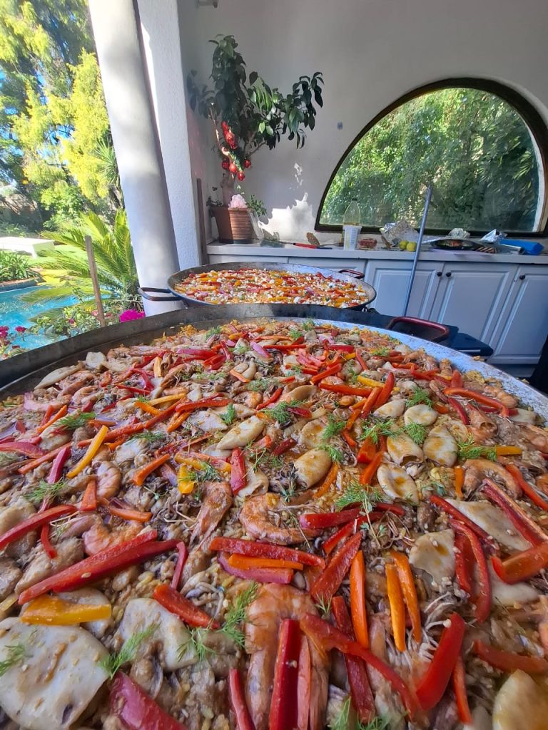 Large seafood paella pan with prawns, calamari and peppers