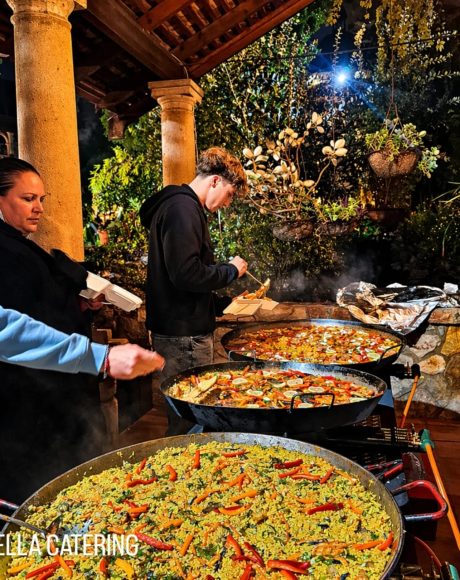Guests enjoying live paella catering at an evening event in Gauteng